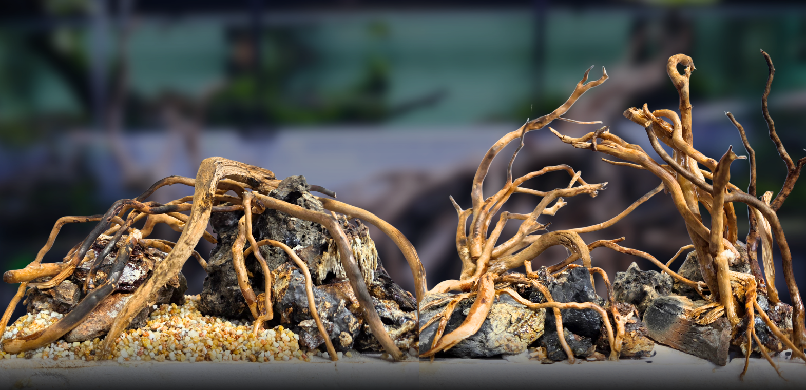 Close-up view of handcrafted aquarium hardscapes featuring intricate wood roots intertwined with natural rocks and gravel. These custom aquascaping hardscape layouts create a realistic forest-inspired landscape ideal for planted aquariums, freshwater aquascapes, and nature-themed aquarium designs.